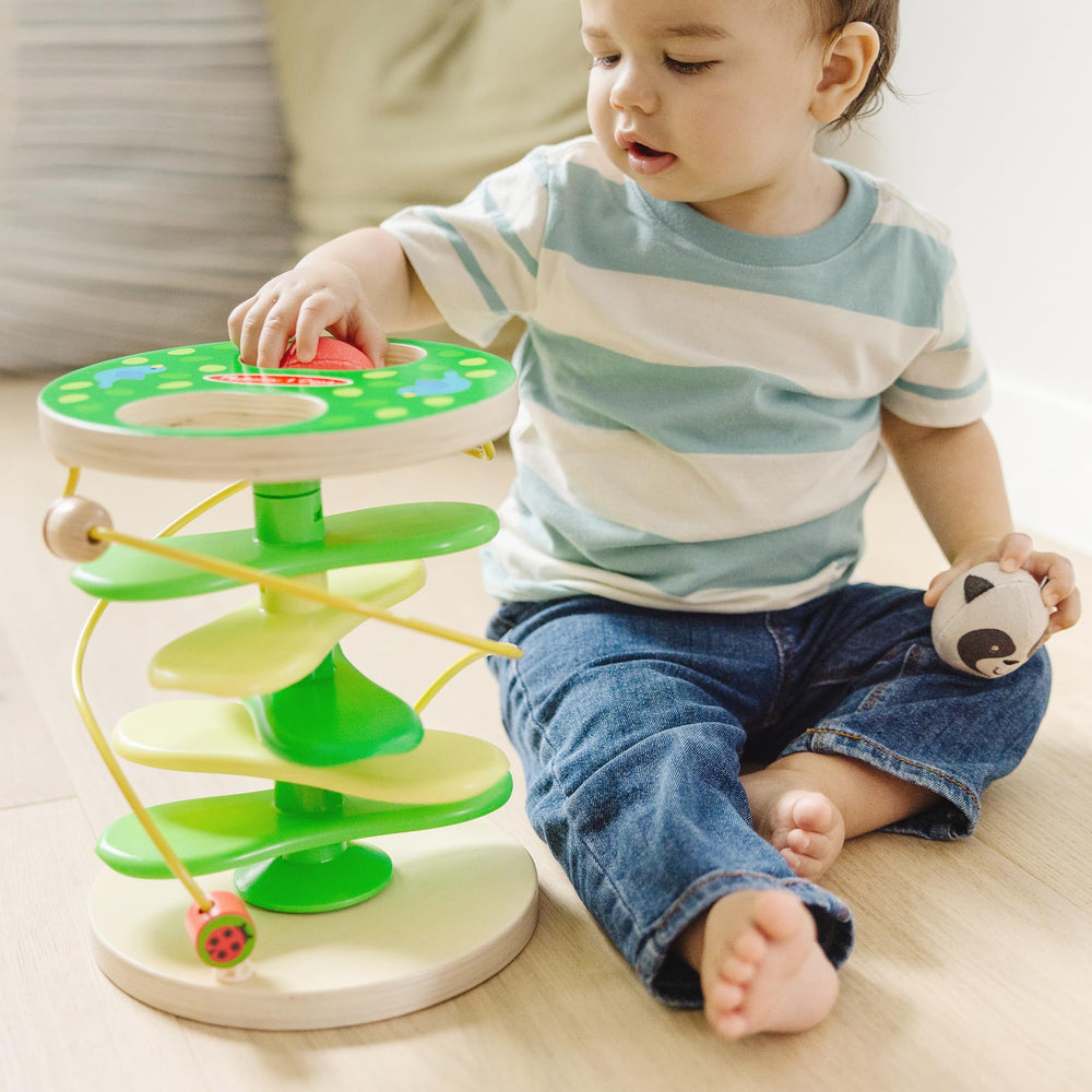 Melissa & Doug Rollables raccoon with chimes enhances tactile exploration.