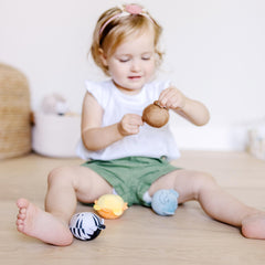 Gift-ready Melissa & Doug Safari Rollables set for 6–24 months.