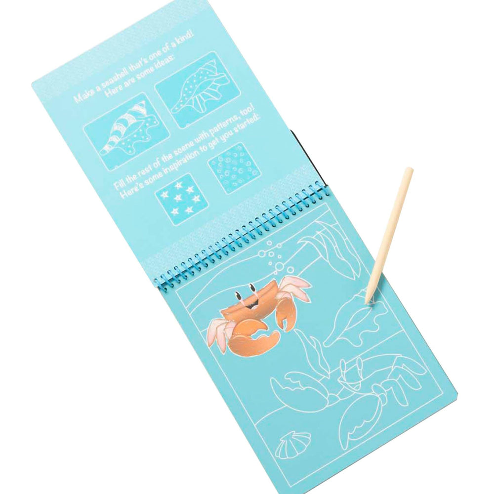 Melissa & Doug Scratch Art pages open to reveal underwater scenes for exploration