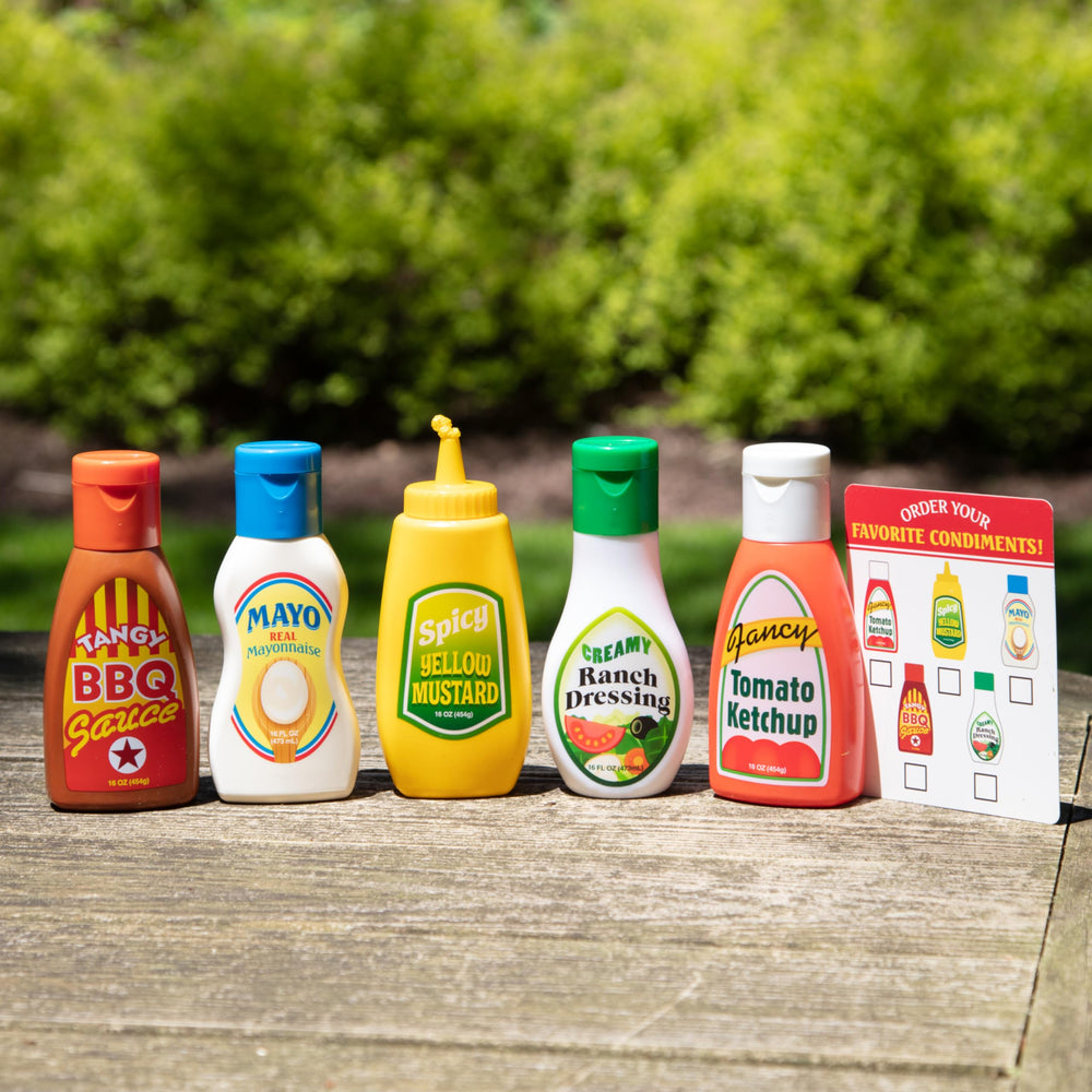 Melissa and Doug condiments set demonstrating interactive bottle tipping