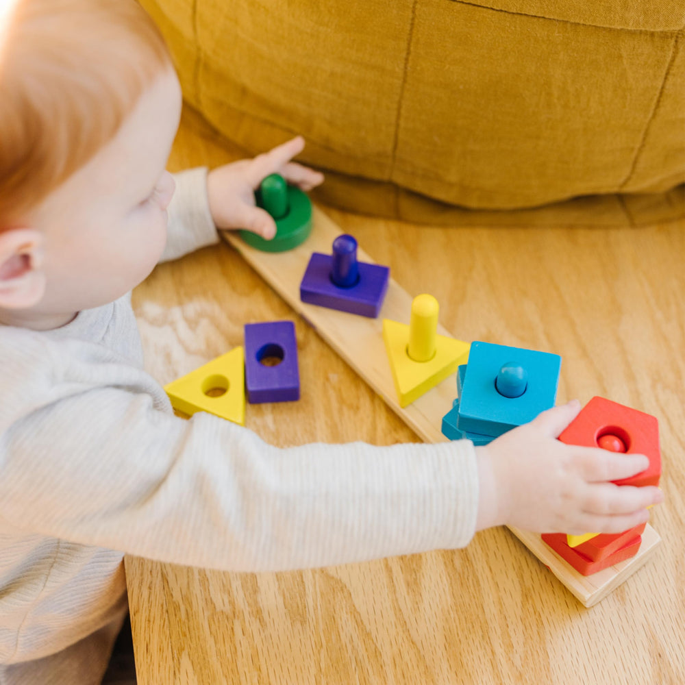 Melissa & Doug Stack and Sort Board shows shapes to aid sorting