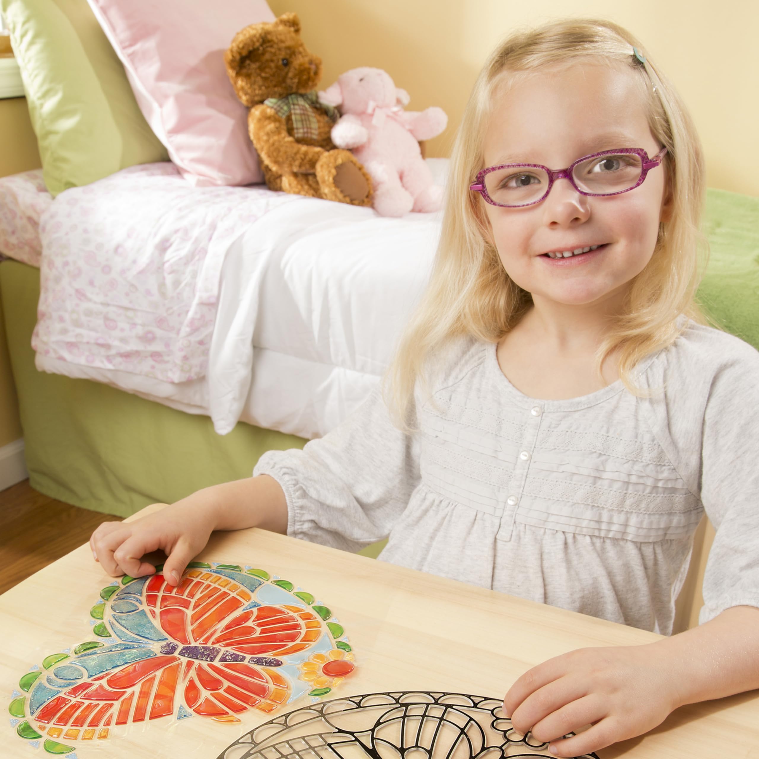 Melissa and Doug stained glass kit includes ready-to-hang cord for quick display