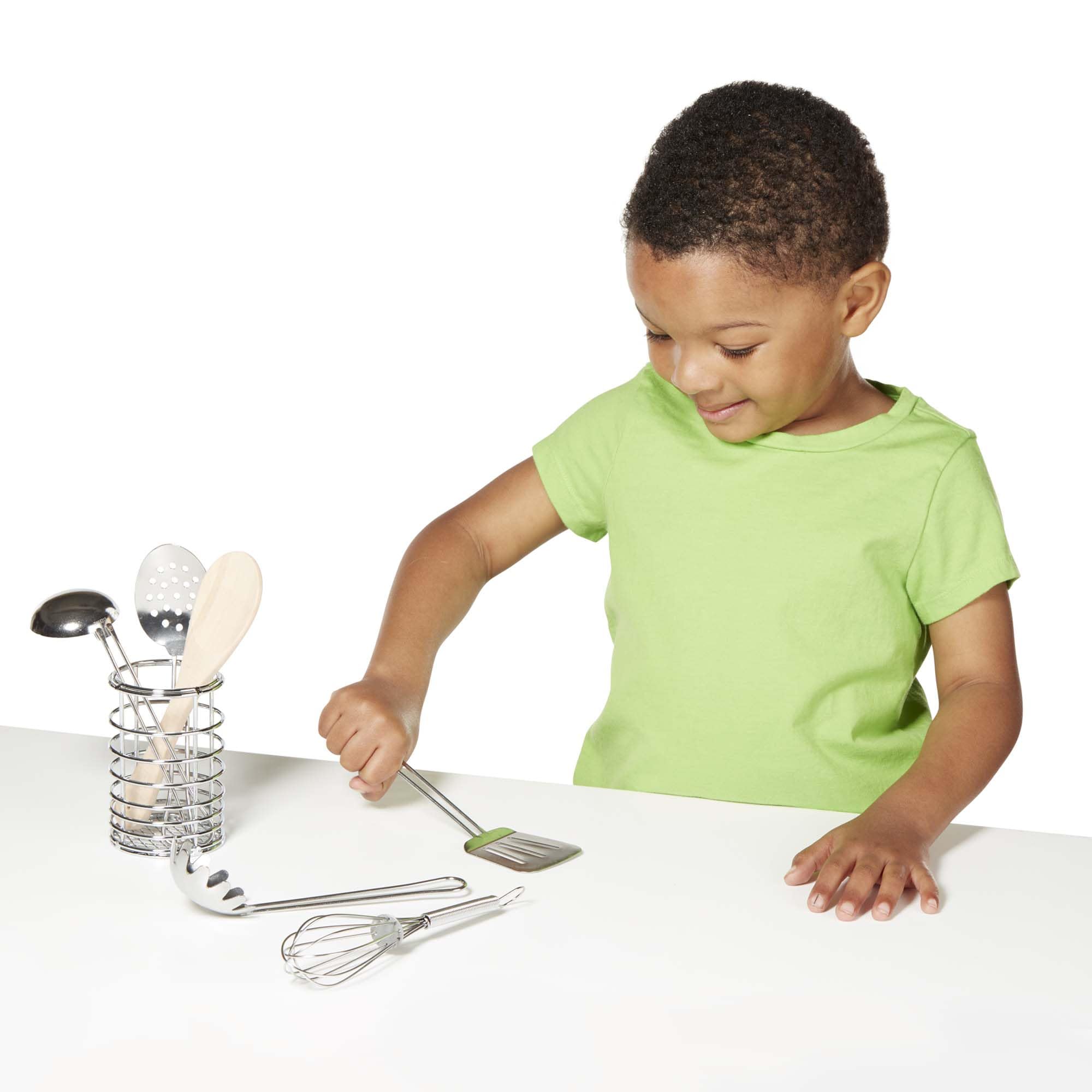 Melissa & Doug Stir & Serve utensils fit naturally within a kitchen playset.