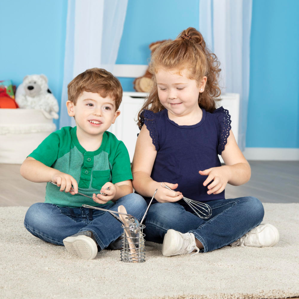 Melissa & Doug Stir & Serve spatula for flipping toy treats with ease.