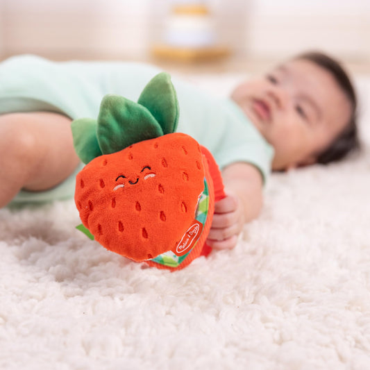 Melissa & Doug strawberry slices with crinkly leaves for tactile exploration.