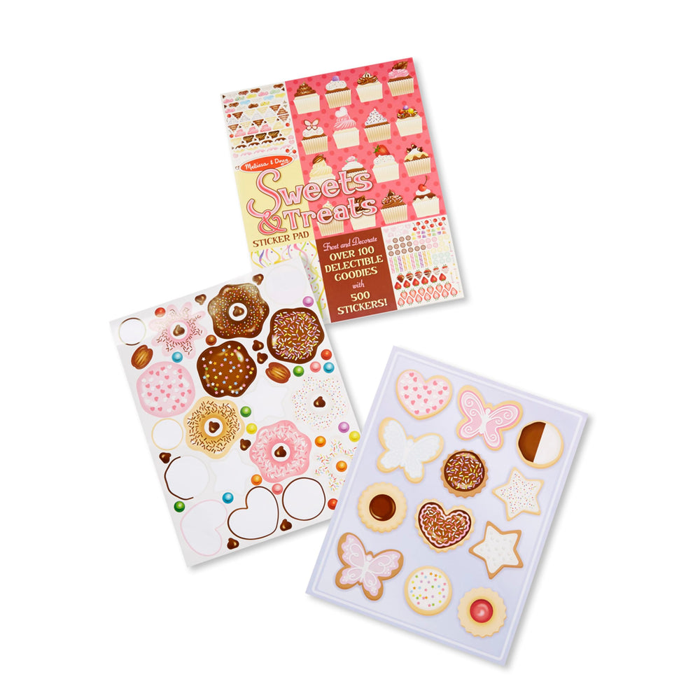 Decorating cupcakes with Melissa and Doug stickers for pretend baking and storytelling.