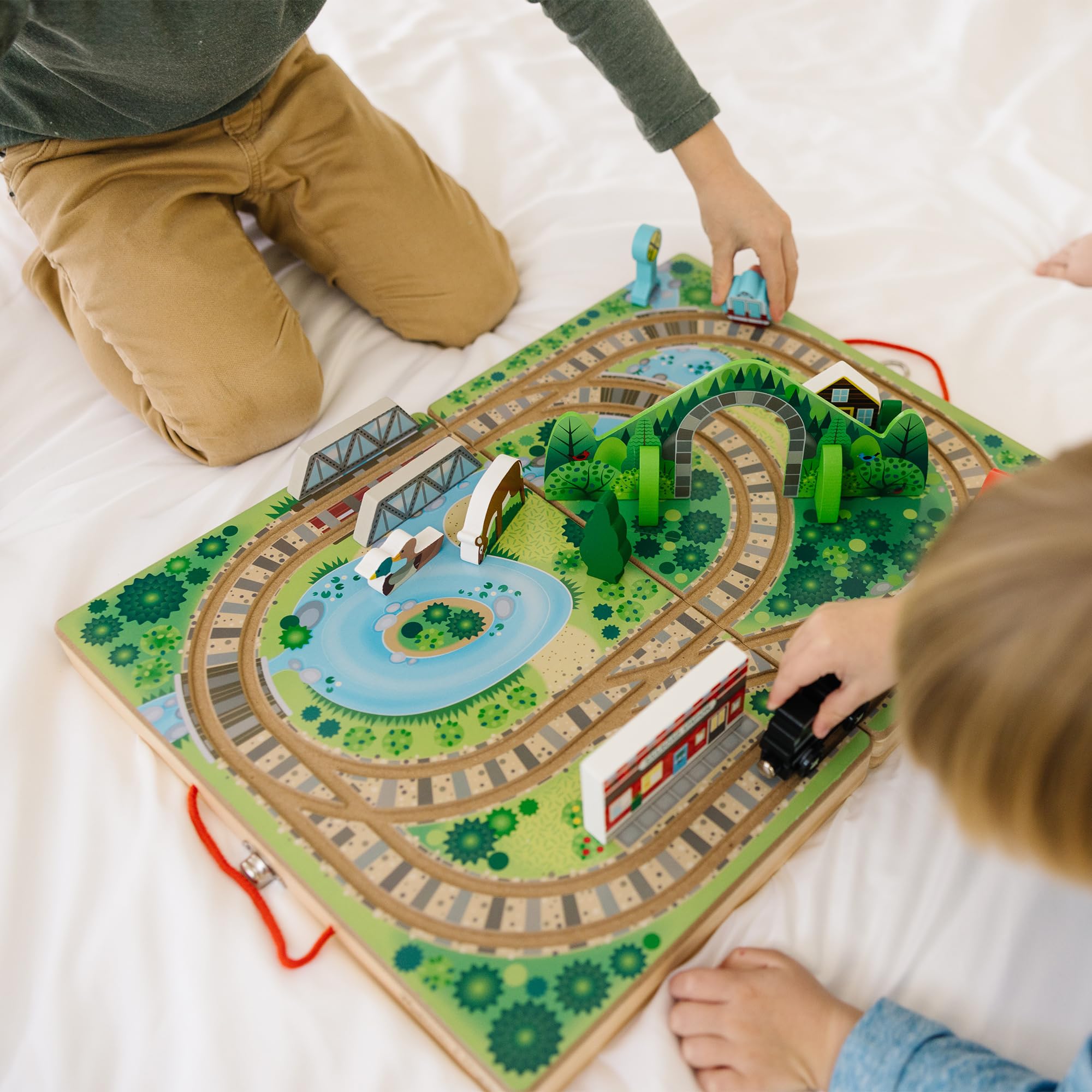 Melissa & Doug Take-Along Railroad offers screen-free play to boost fine motor skills.