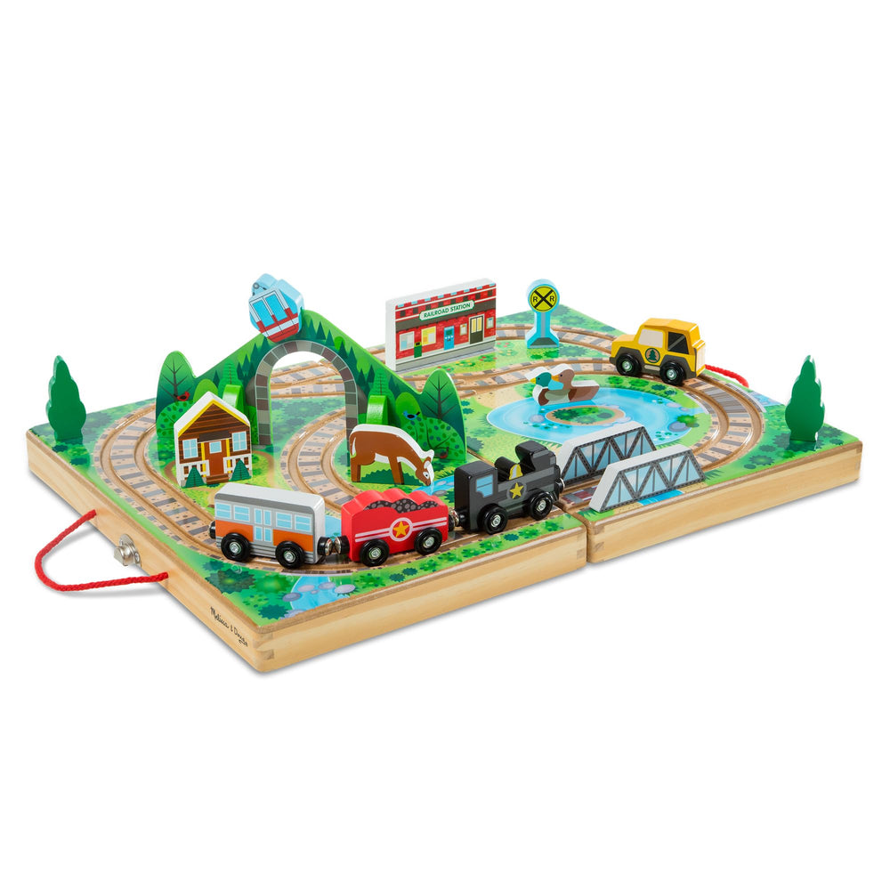 Melissa & Doug Take-Along Railroad case opened with colorful tracks for portable play.