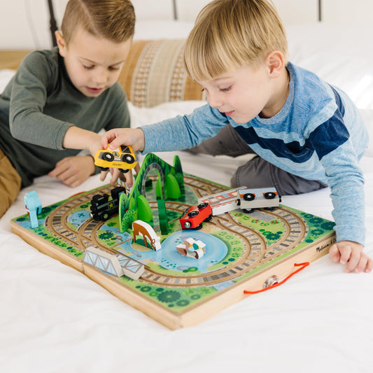 Melissa & Doug Take-Along Railroad tracks and mountain tunnel inviting imaginative adventures.