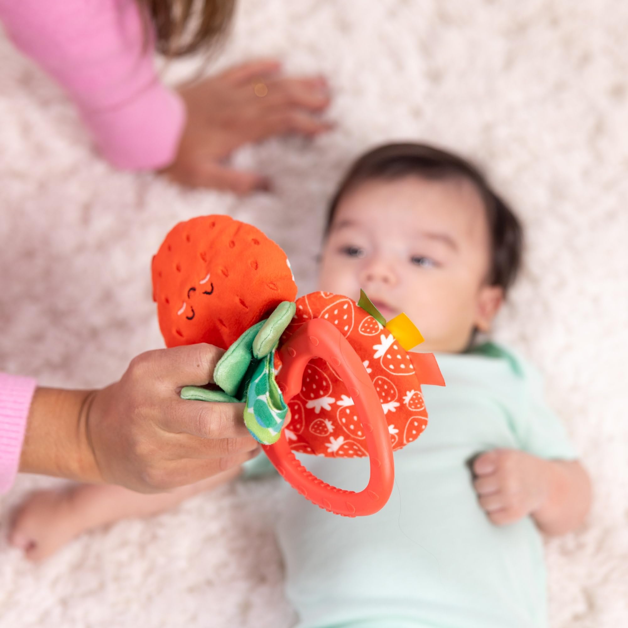 Melissa & Doug three-piece strawberry toy for exploration.