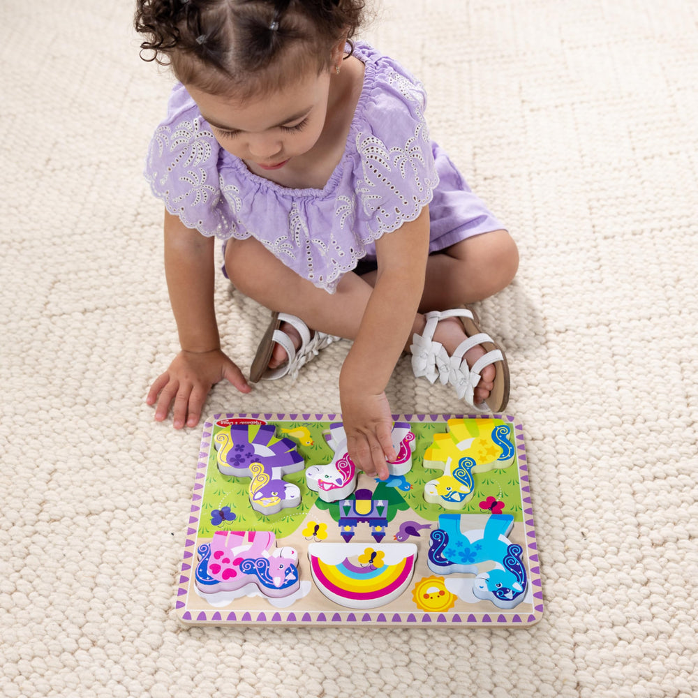 Melissa & Doug unicorn pattern piece reinforces visual matching beneath pieces.