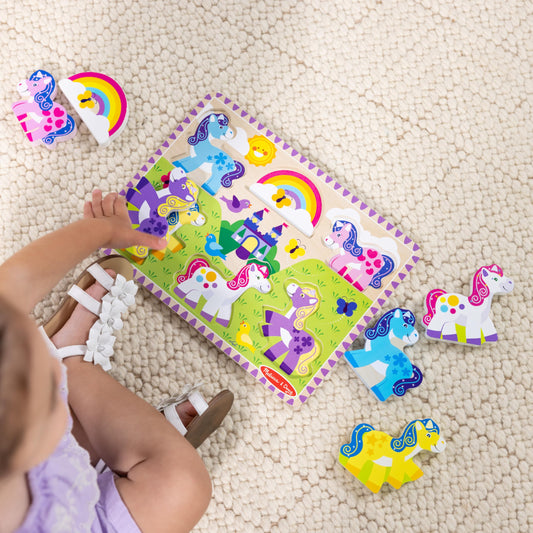 Melissa & Doug pink unicorn piece supports grasping and color exploration.