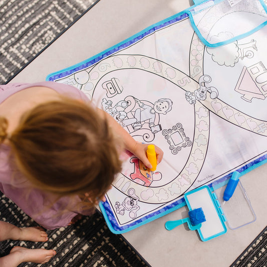 Melissa & Doug Water Wow pens shown beside the mat for water-based drawing