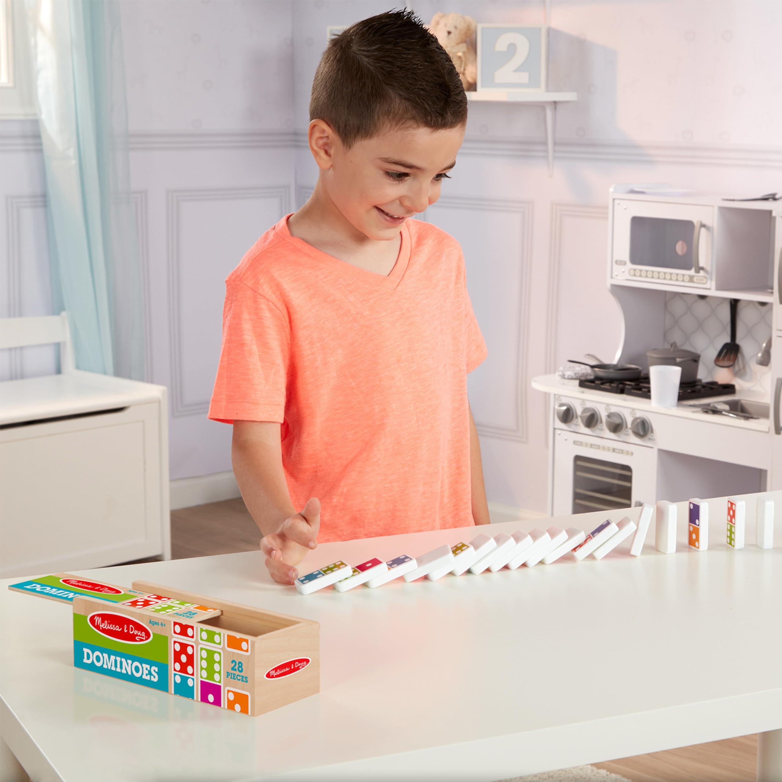Melissa & Doug wooden storage box with lid keeps dominoes organized and ready to display