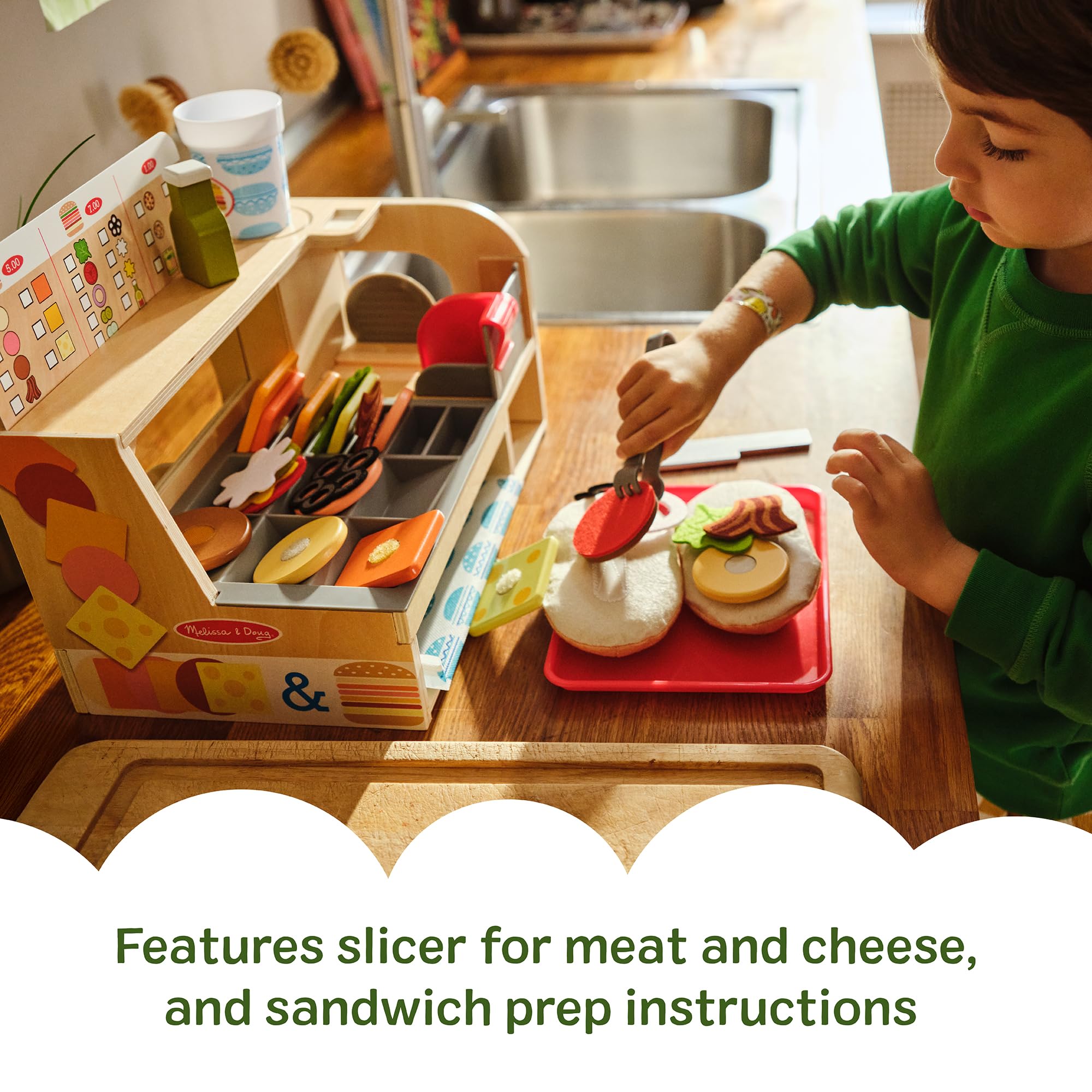Melissa & Doug working slicer feature encourages realistic slicing in pretend kitchen play.