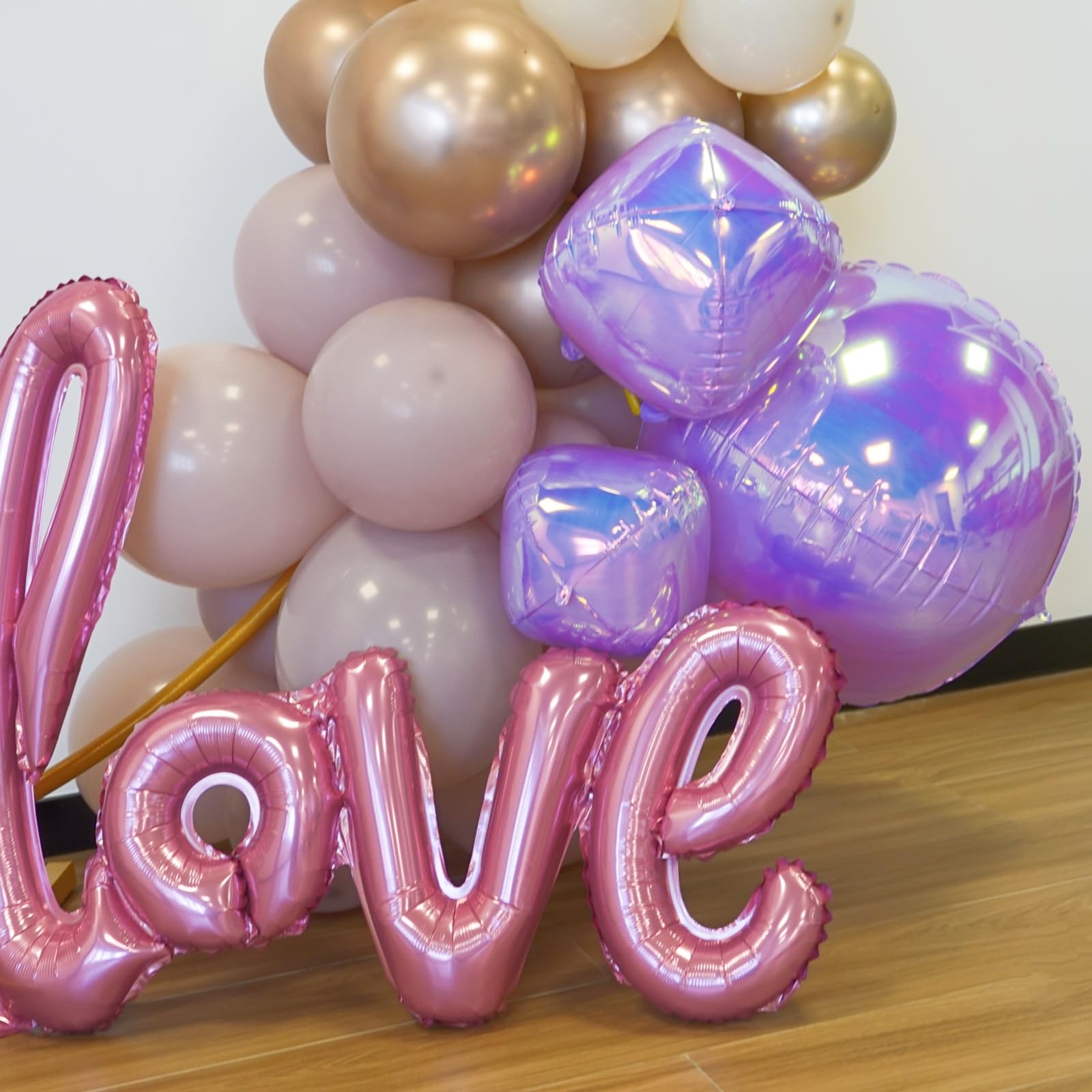 Melody Fantasy iridescent 10in foil balloon enhances tables and decor with color.