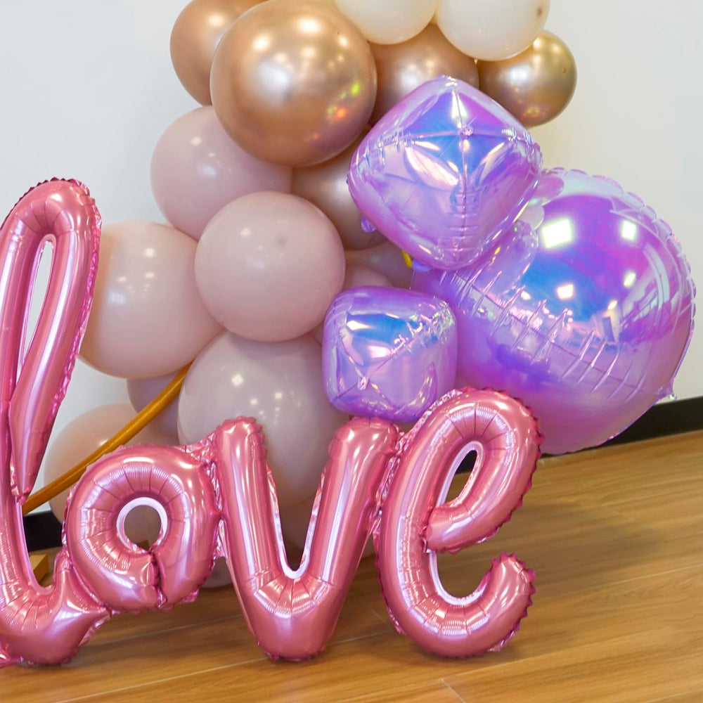 Melody Fantasy iridescent 10in foil balloon enhances tables and decor with color.