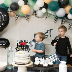 MEMOVAN race car topper on cake, creates a memorable photo moment.