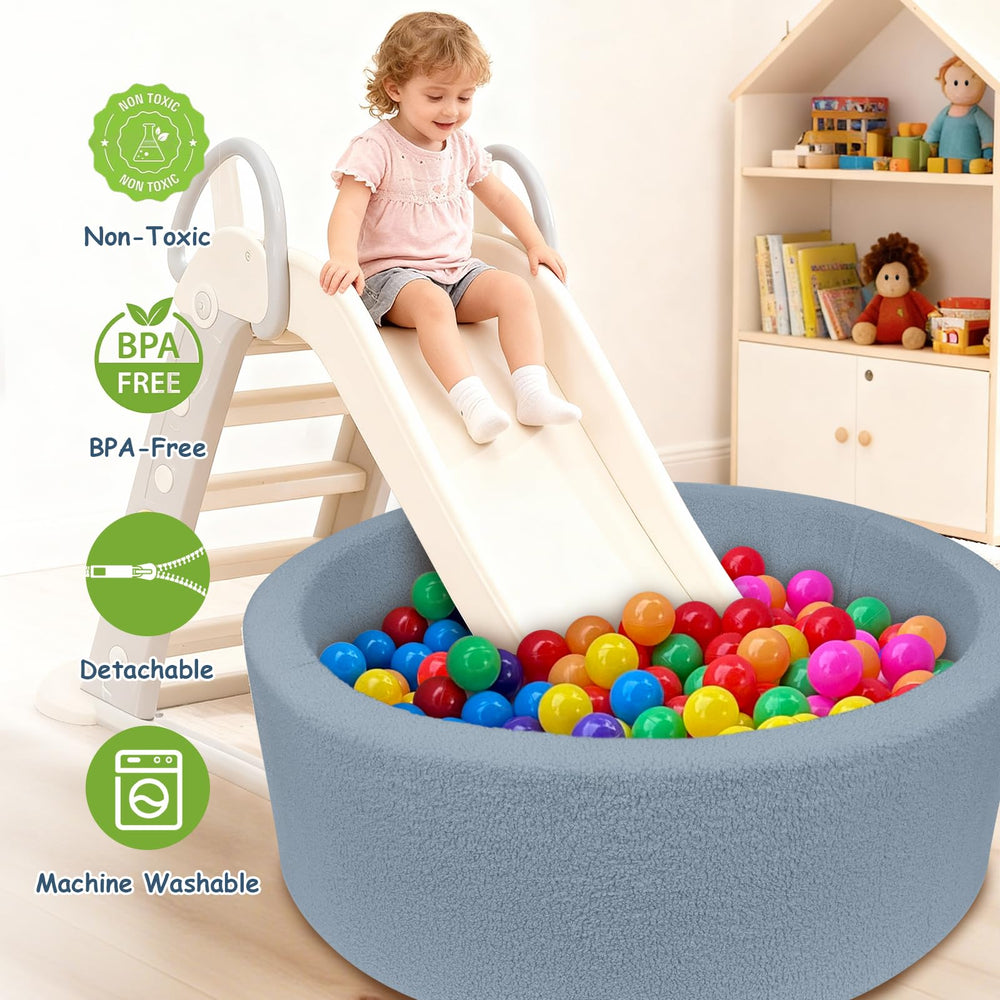 MEOGETY ball pit used as a playful photo prop for kids.