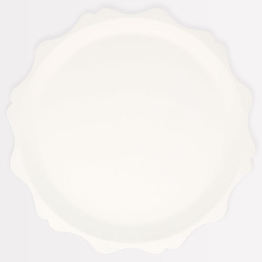 Meri Meri decorative-edge cream plates elevating party tables with sustainable design.
