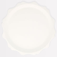 Meri Meri decorative-edge cream plates elevating party tables with sustainable design.