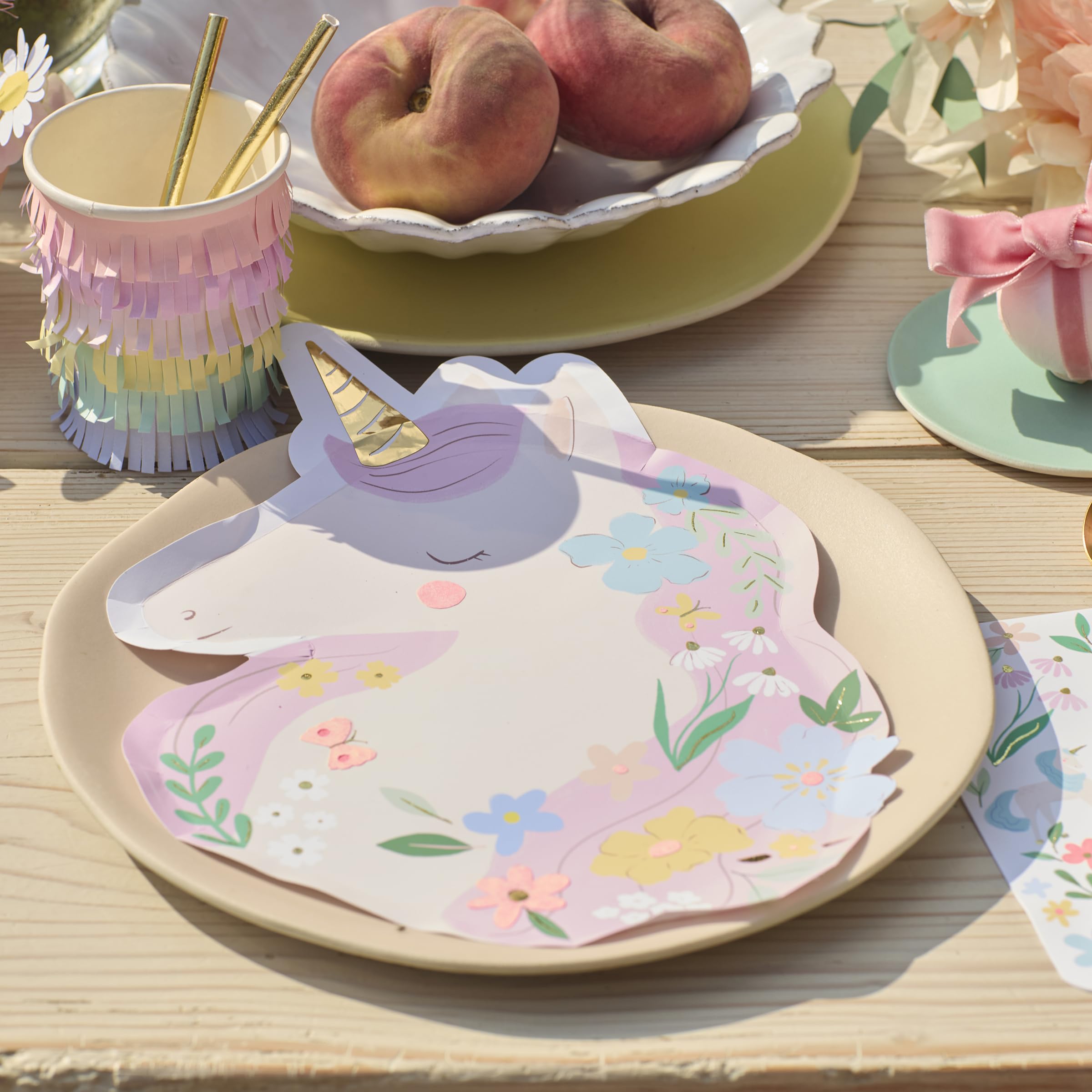 Meri Meri Meadow Unicorns plates on a table demonstrating 450gsm durability for hot or cold foods.