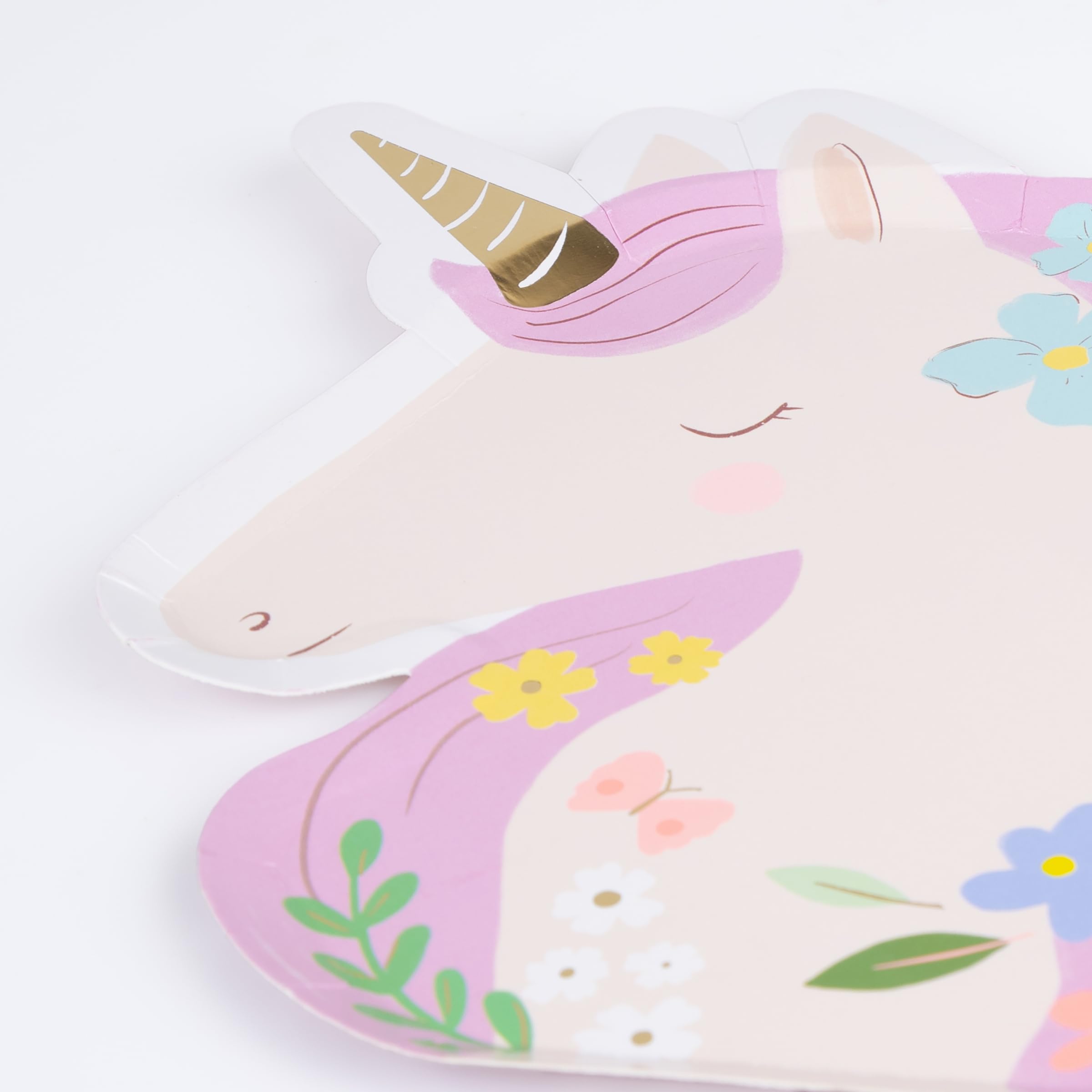 Meri Meri Meadow Unicorns plates arranged in a pastel, whimsical tablescape for celebrations.
