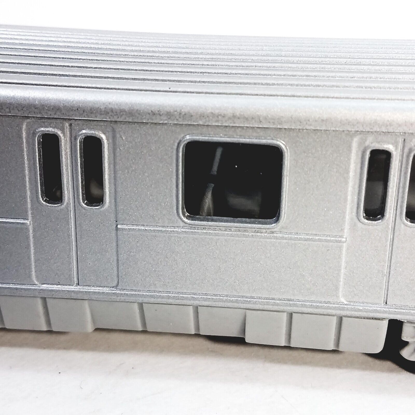 METRO diecast subway train side view highlights sleek profile for display.