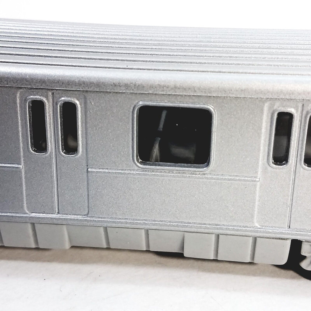 METRO diecast subway train side view highlights sleek profile for display.