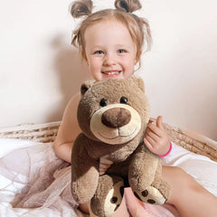 Mewkou 24-inch weighted bear used as a plush pillow for relaxation.