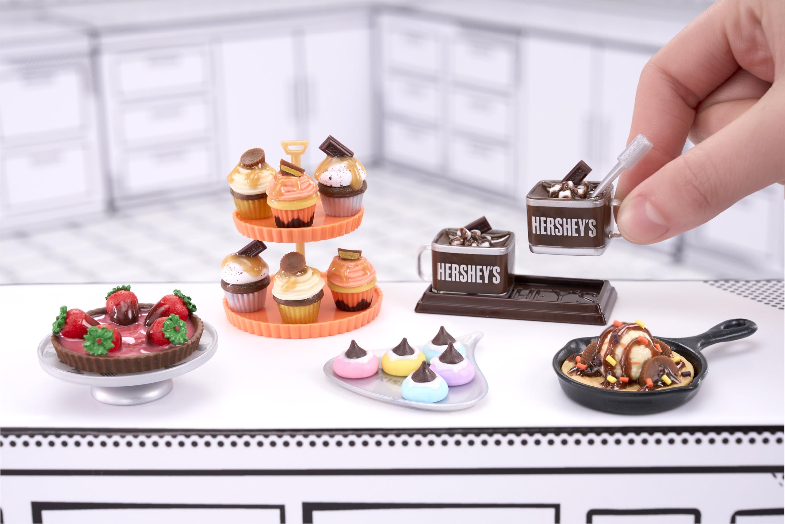 Mini Reese's cups replica offers collectible charm for shelving.