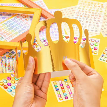 MGZTTHW kids decorating crowns with colorful stickers during a joyful party.