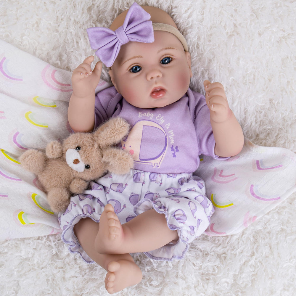 Milidool gift-set doll with clothes, bottle, and pacifier included for gifting.