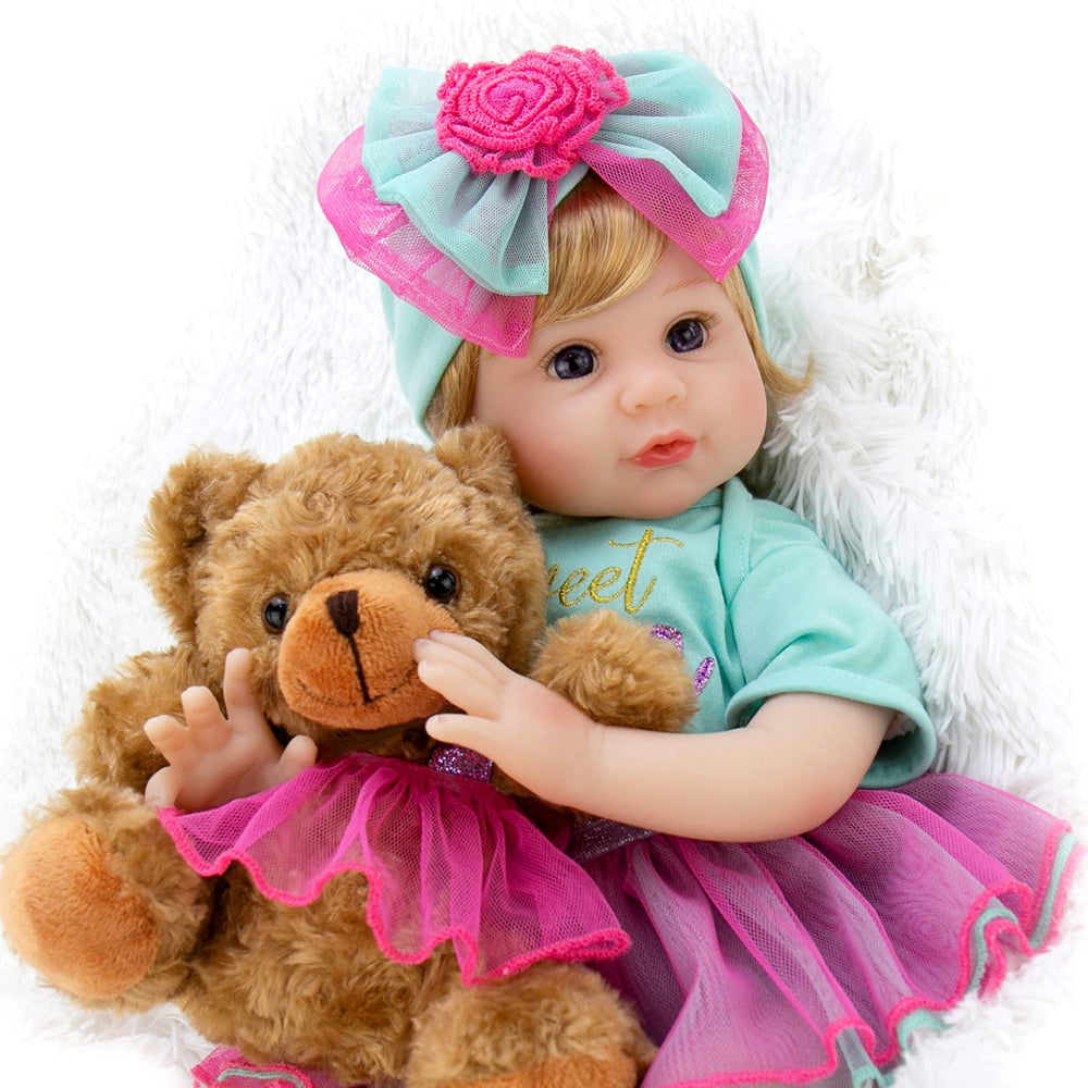 Milidool lifelike reborn doll in blue onesie for imaginative play.