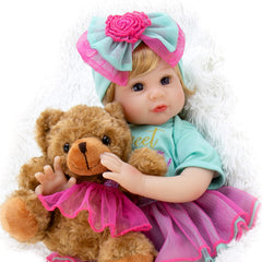 Milidool lifelike reborn doll in blue onesie for imaginative play.