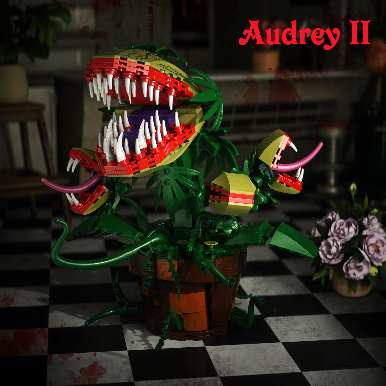Three Audrey II mini plants add texture to a horror-themed setup