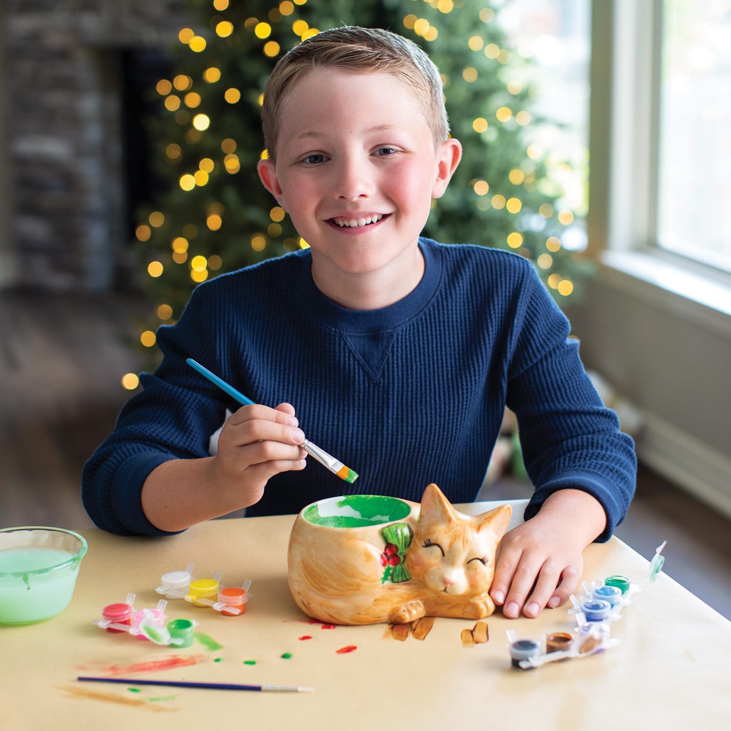 MindWare cat dish showcases seasonal designs for Halloween and Christmas.