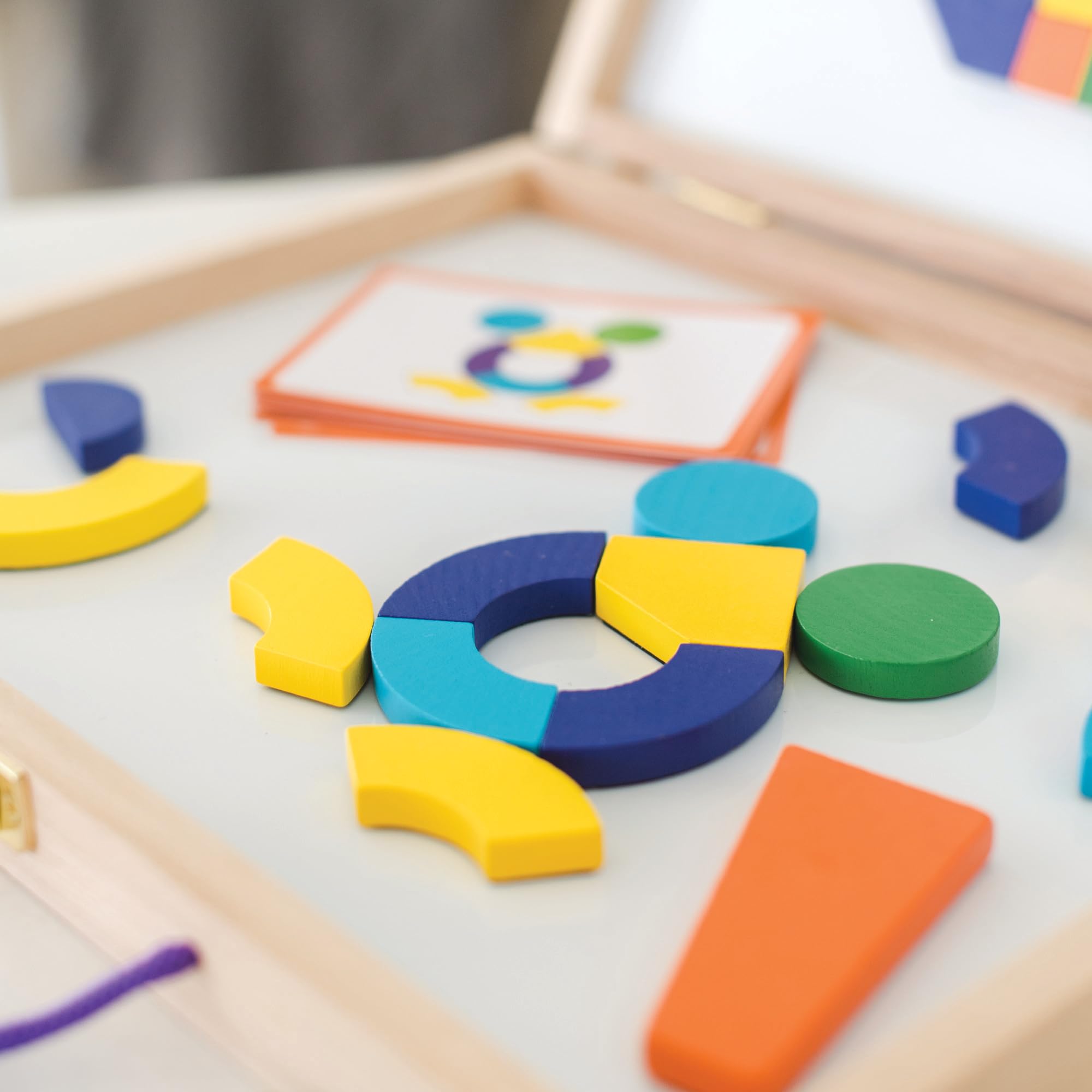MindWare Imagination Magnets dry-erase surface invites ongoing creativity after puzzles.