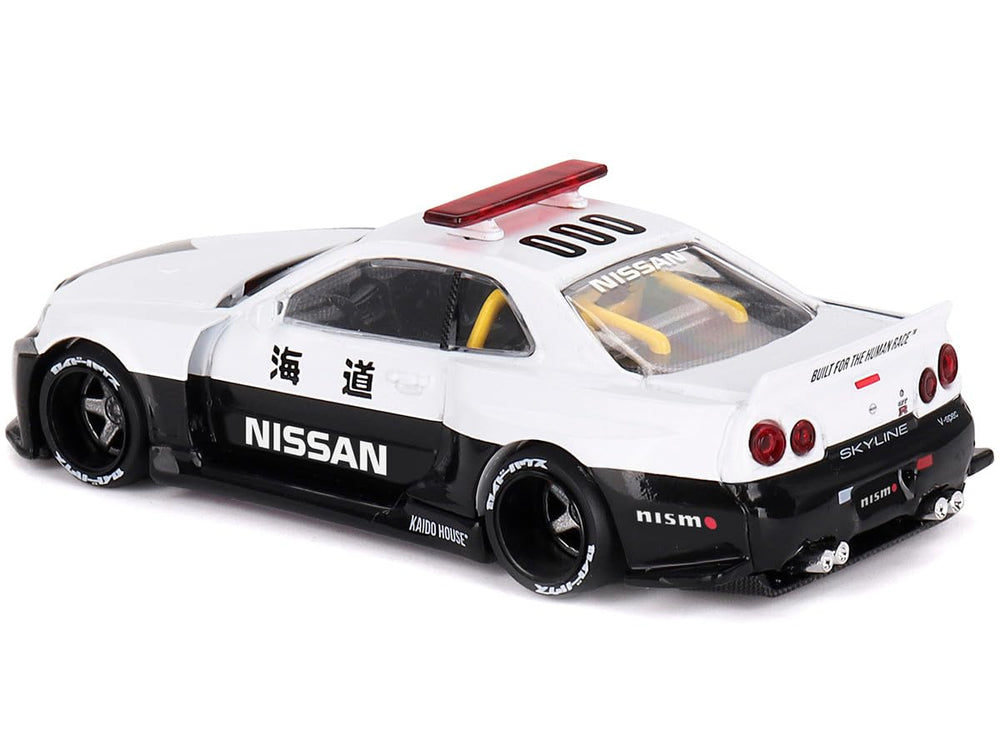 Mini GT Skyline GT-R R34 Kaido Works V2 Aero police livery for display and collection.