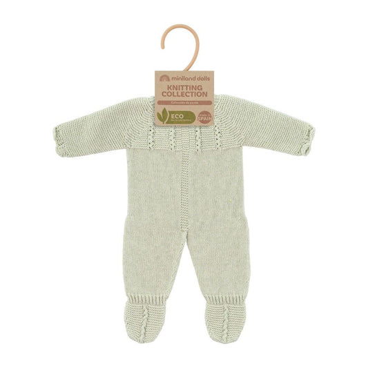 Close-up of Miniland green doll clothes fabric, highlighting ECO materials and durable stitching.