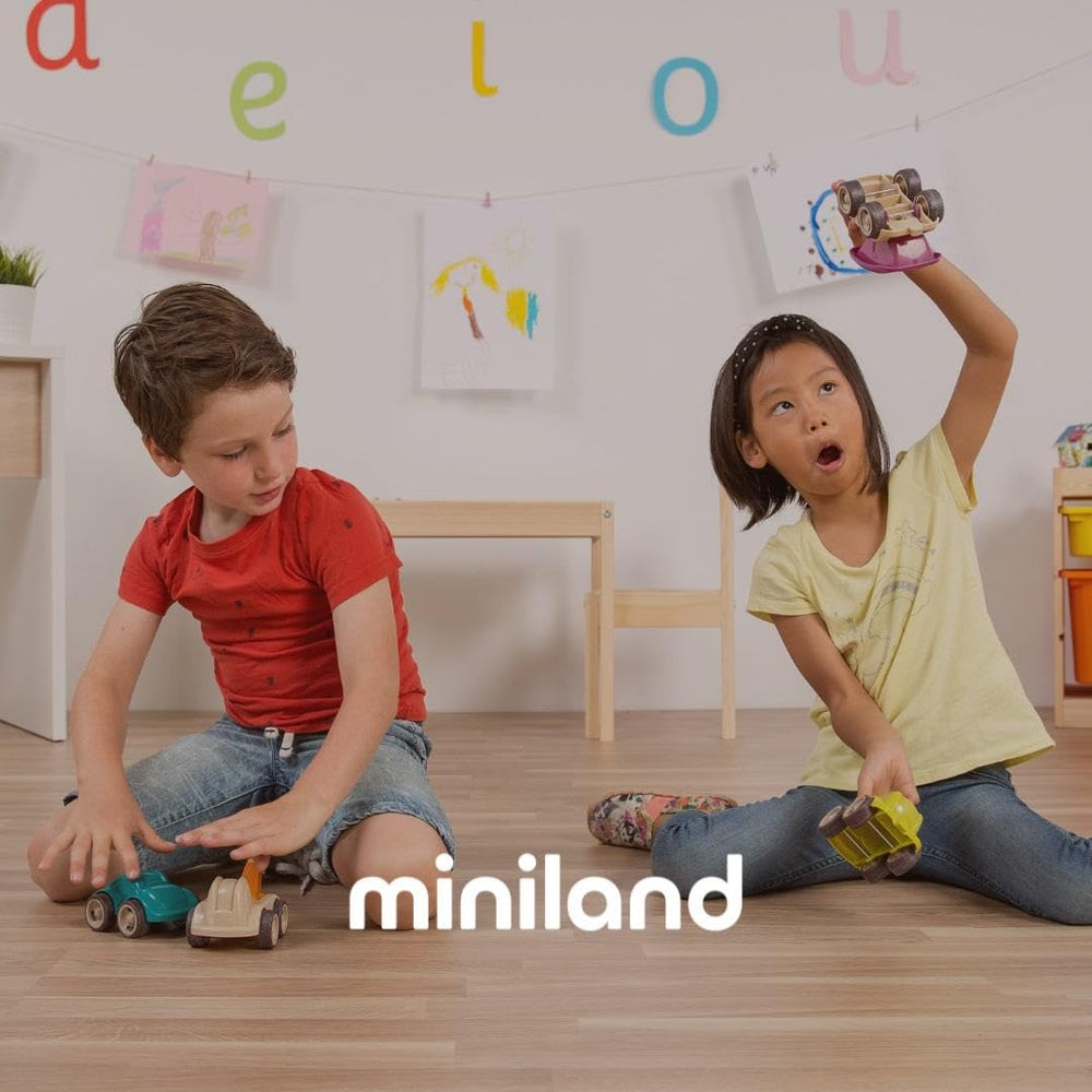 Miniland green pajama set on a doll demonstrates easy dressing