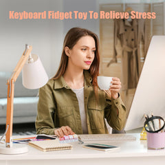 Mintcaps compact 4-button layout fits fingers naturally for stress relief.
