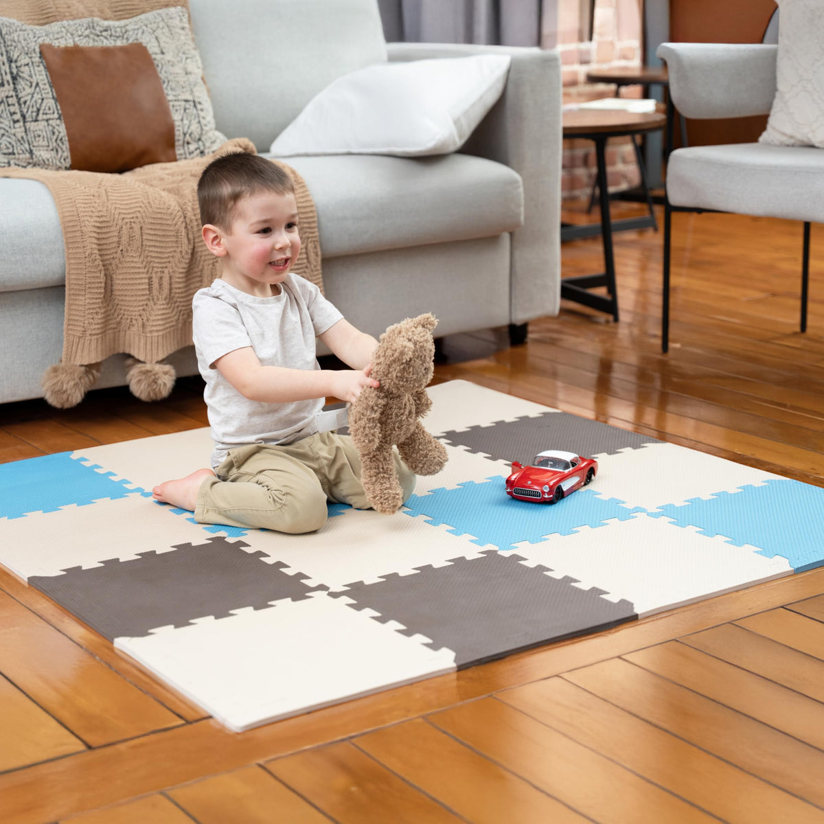 MioTetto baby play mat tiles form a colorful puzzle surface for safe crawling