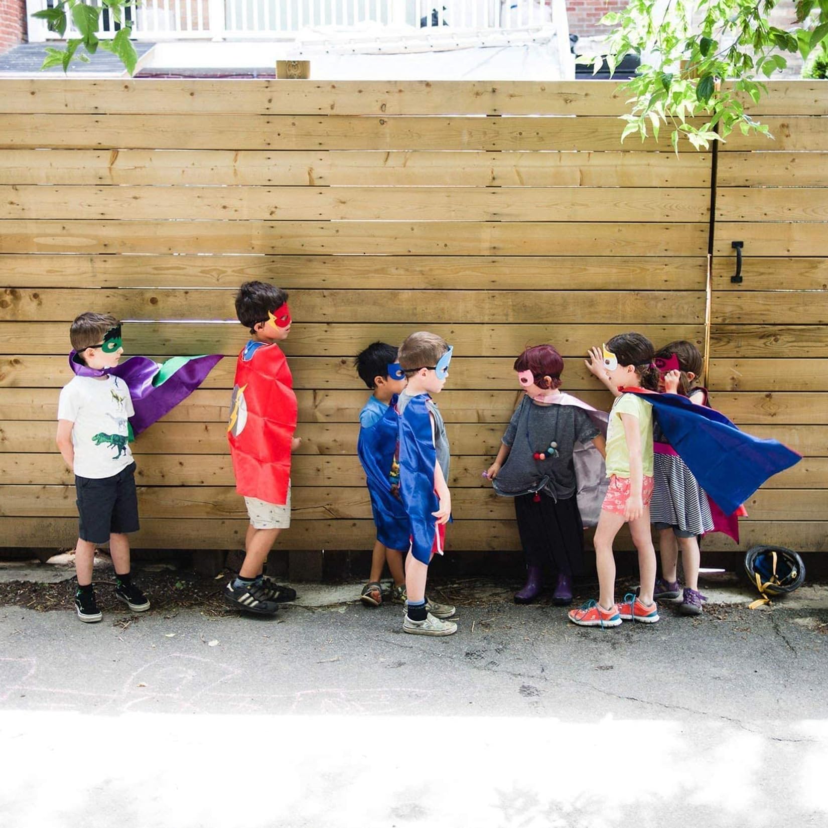 Mizzuco adjustable cape fasteners illustrating easy sizing for growing kids