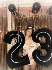 Mluchee 40-inch black number 8 balloon displayed on the floor