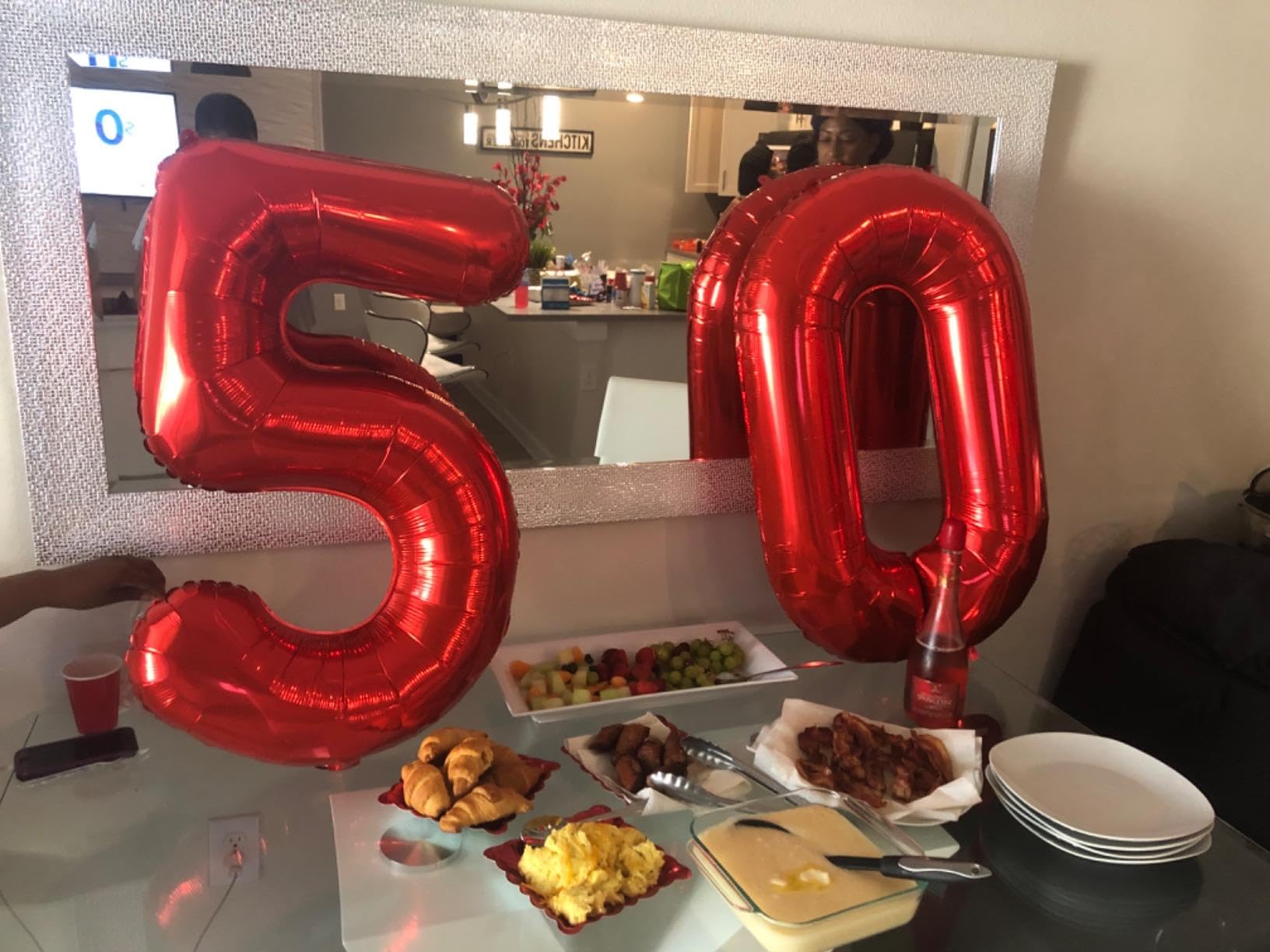 Mluchee 40-inch number balloon 50 serves as a striking party centerpiece and prop.