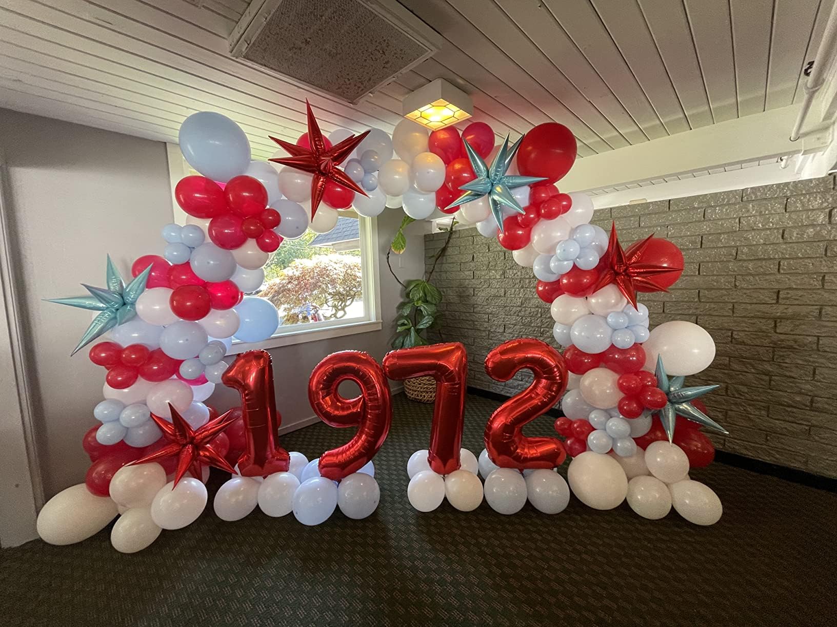 Mluchee 40-inch number balloon 7 as colorful wall decor for celebrations.