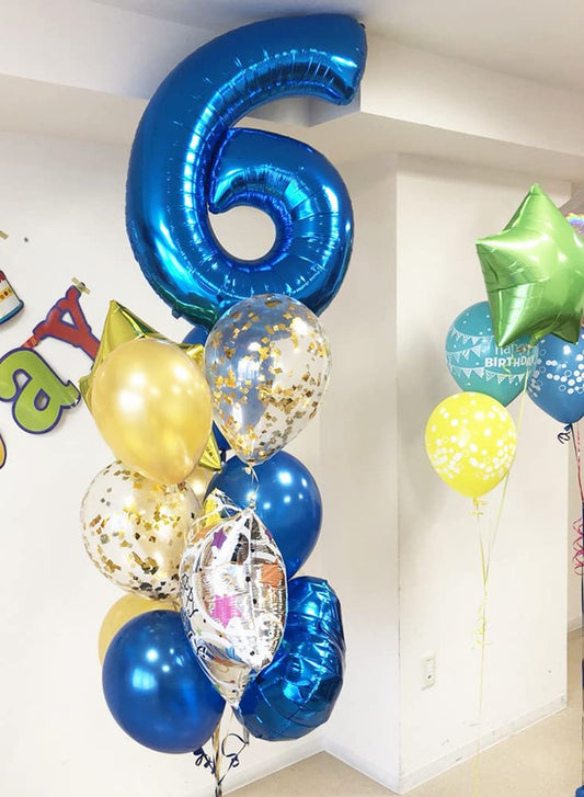 Mluchee 40-inch navy blue number balloon used as wall decoration for celebrations.