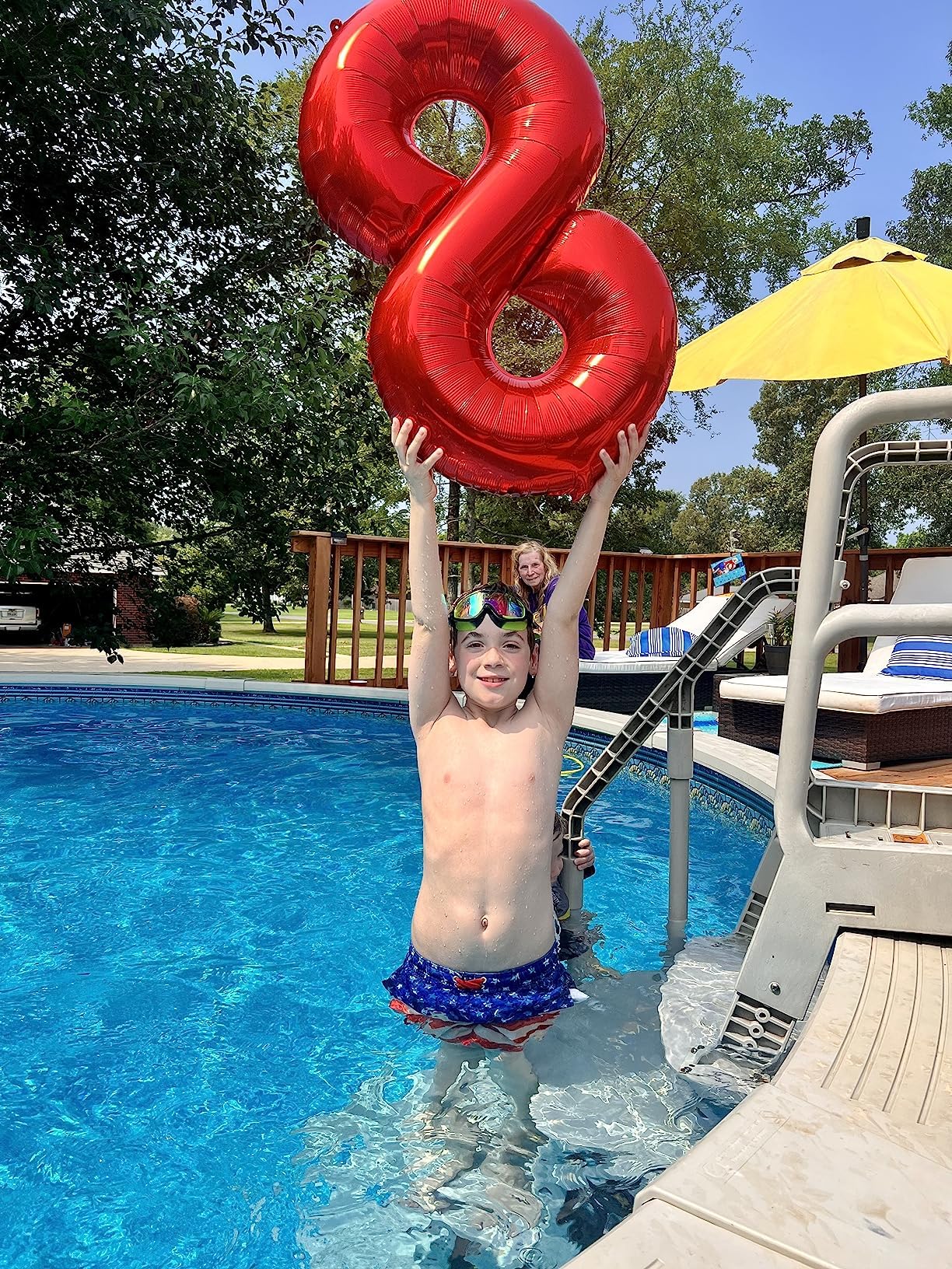 Mluchee 40-inch red number balloon 9 stands on the floor for dramatic displays.