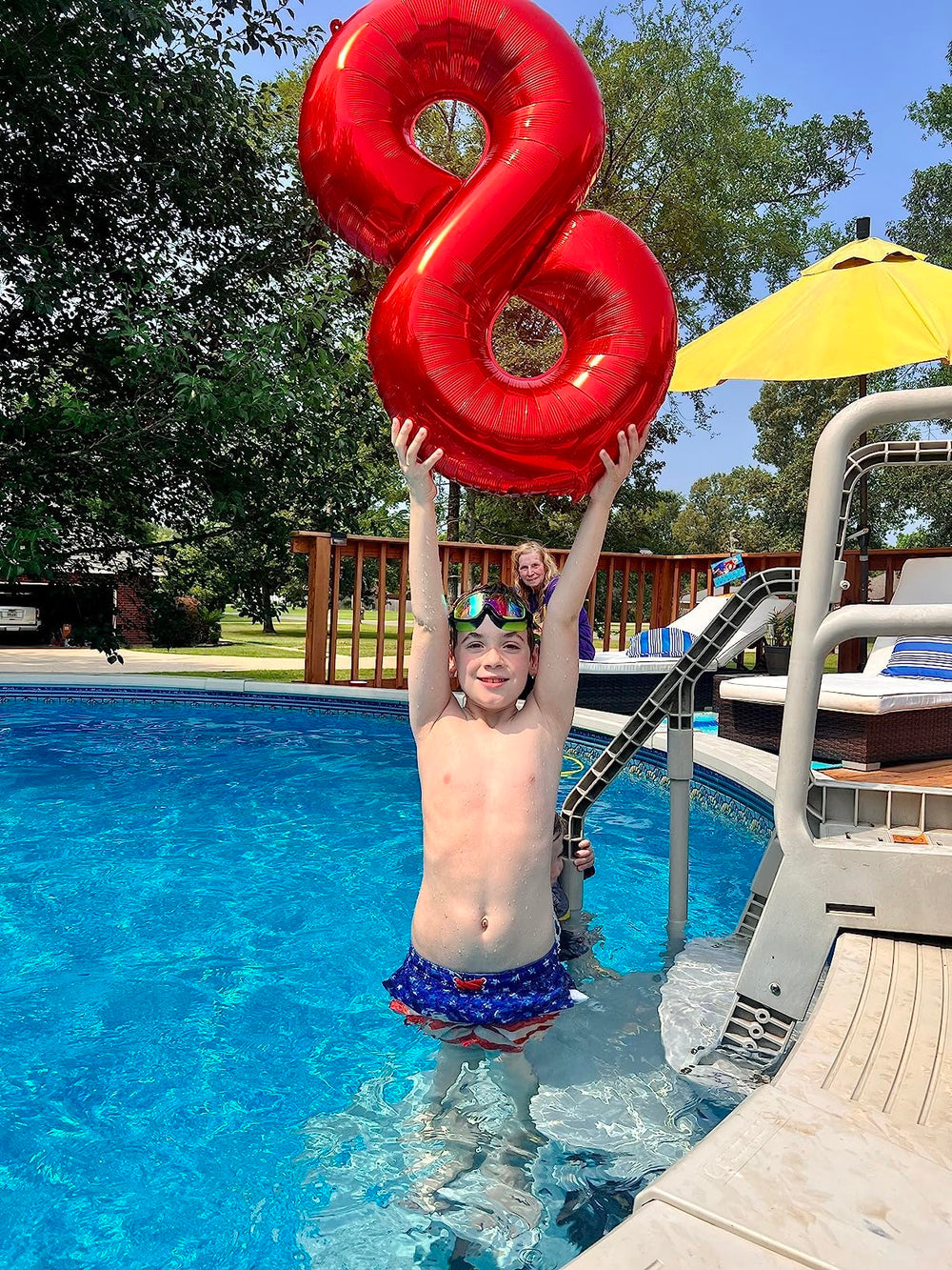 Mluchee 40-inch red number balloon 9 stands on the floor for dramatic displays.